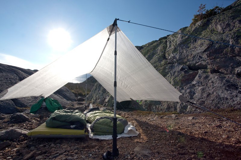 pitching a tent with trekking poles saves you the weight (1-1.5 lbs)...