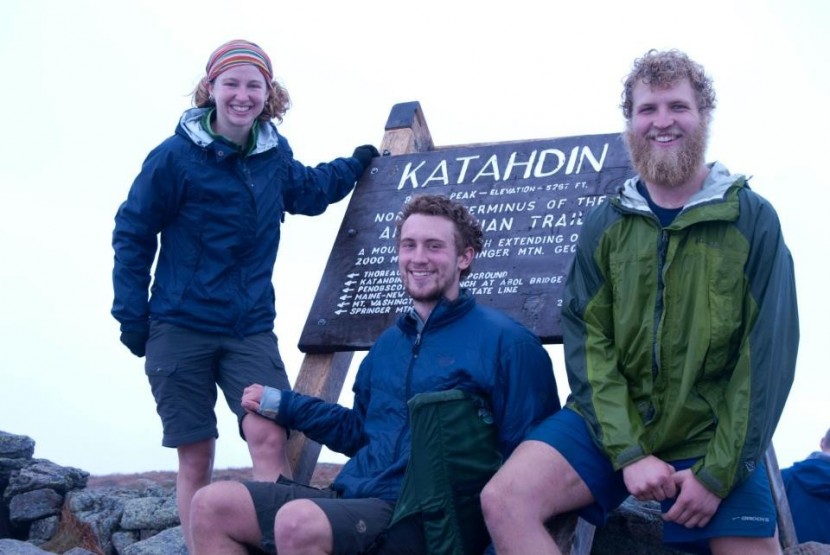 happy at the finish line of the appalachian trail, wearing...