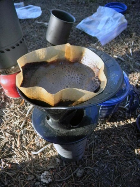 coffee slowly dripping through the small hole on the melitta ready...
