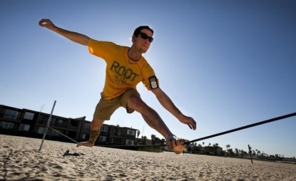 Brian Blum slacklining at the beach.