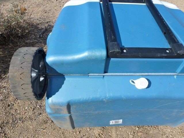 igloo island breeze 60 roller - detail of the wheel, axle, and drain area of igloo's island breeze...