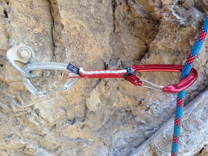 wild country helium quickdraw - the exterior rubber positioner keeps the bottom carabiner in its...