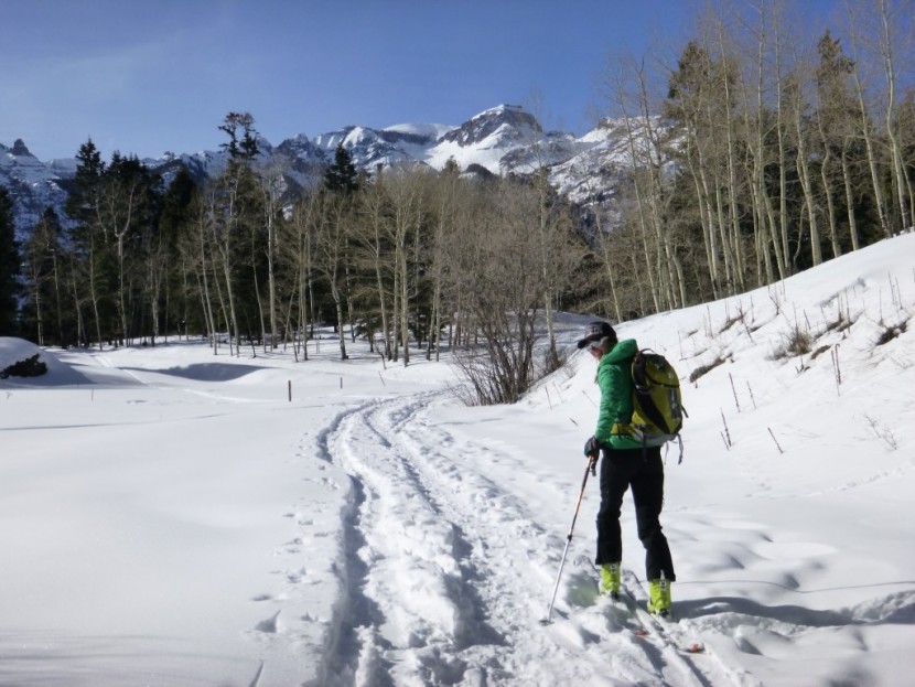 pow gem - brittany skins up and skis down on this blue bird day without taking...