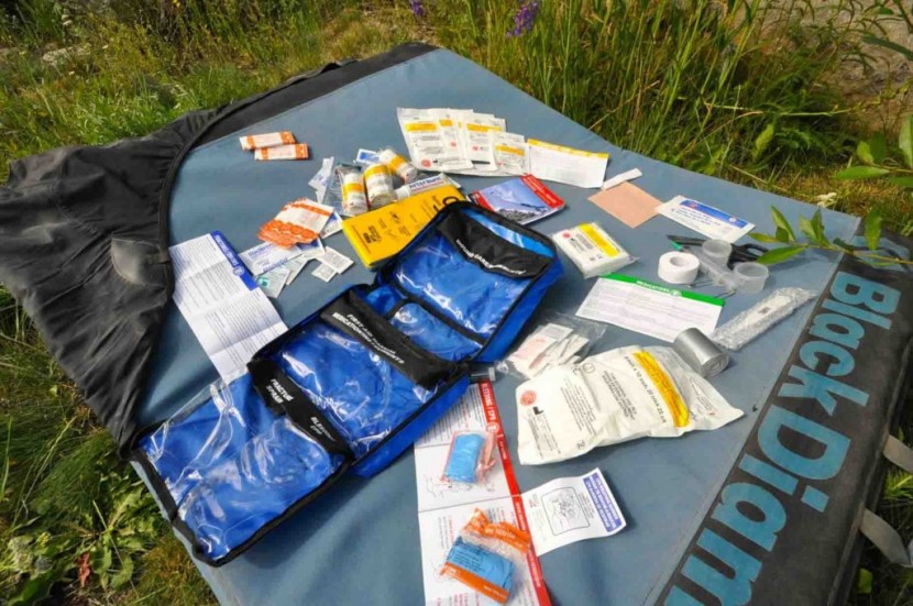 adventure medical kits mountain series fundamentals - this kit's contents. note the tri-fold layout, clear pockets and...