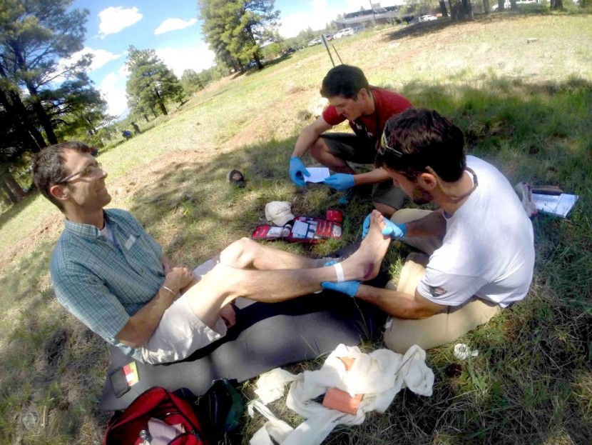 first aid kit - students on a wilderness first responder refresher course utilizing...