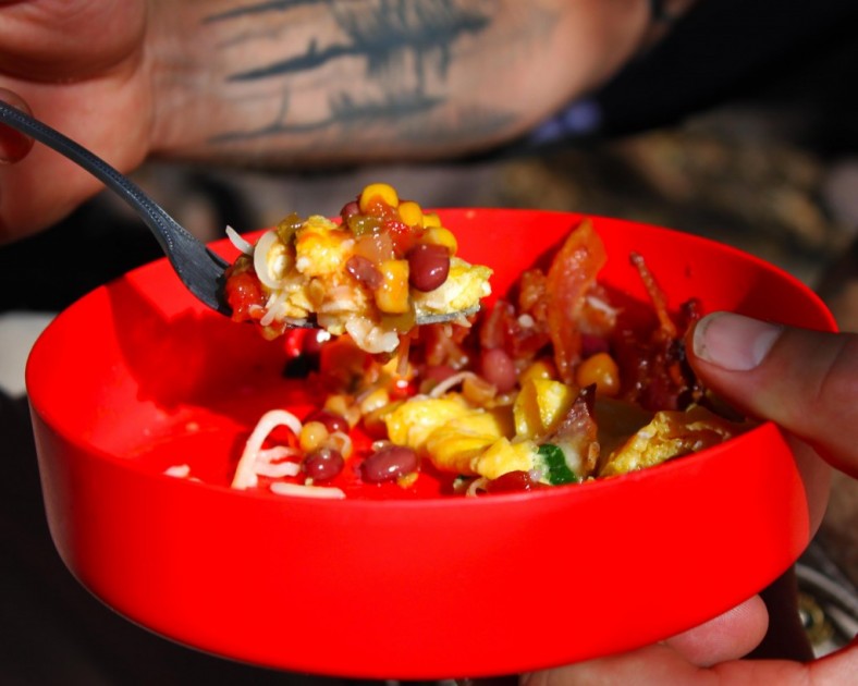 a loaded omelet with bacon, spinach, mozzarella and toped off with...