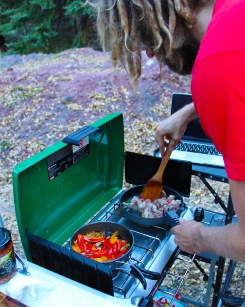 optimus terra he cookset - ryan prepares a yummy and colorful meal of pork fajitas on one of...