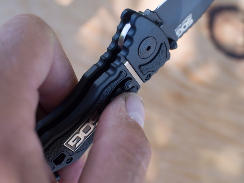 sog trident elite - the small set of concentric circles near the pictured thumb is the...