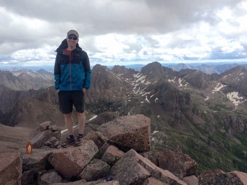patagonia alpine houdini - on the summit of mt. eolus, a 14er in the weminuche wilderness of...