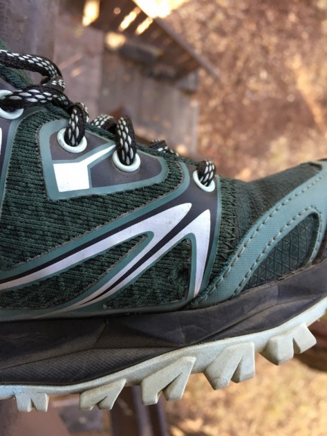 merrell capra bolt mid for women - here, signs of wear show on the mesh upper and along seams at the...