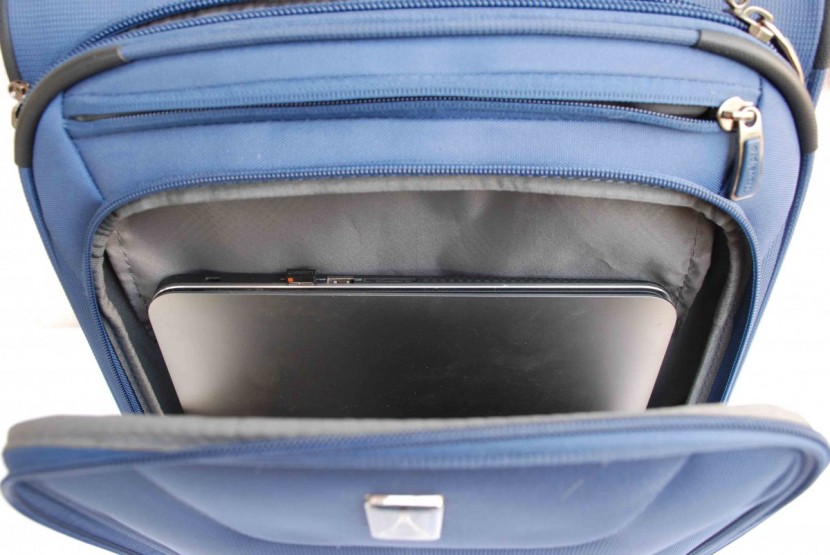 travelpro maxlite 5 22 expandable rollaboard - the external pocket can fit a large laptop, but it does make it more...