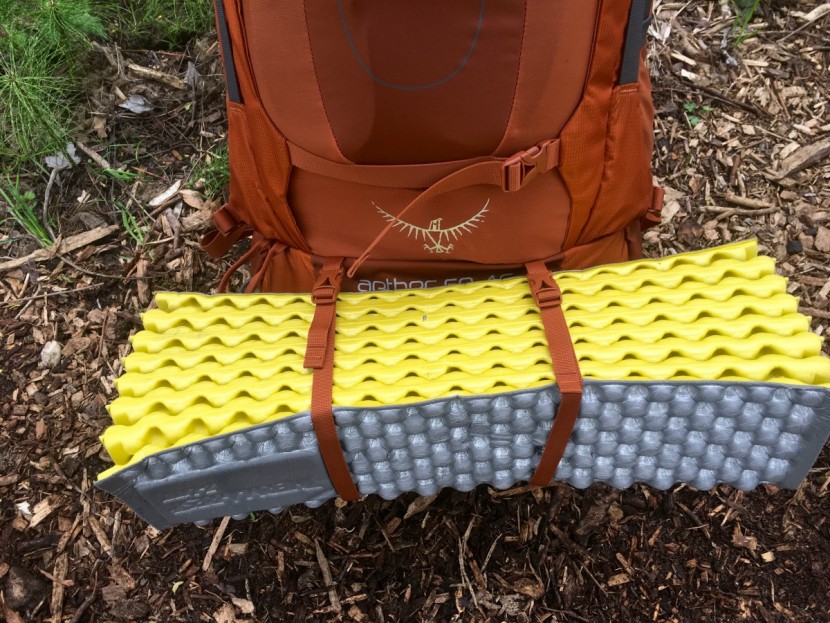 osprey aether ag 60 - the aether features two straps at the bottom of the pack above the...