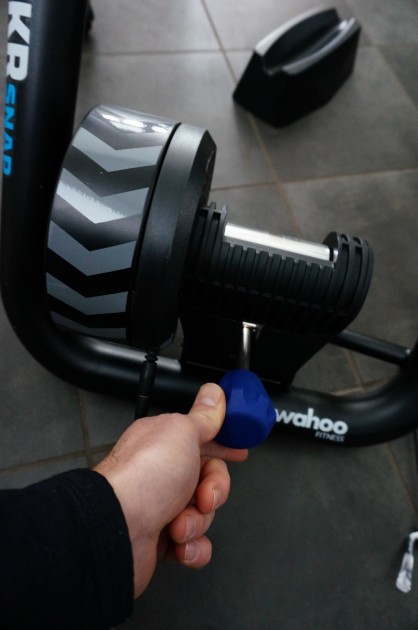 wahoo fitness kickr snap - this blue knob adjusts the rear tire tension on the drum of the...
