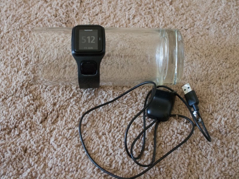 tomtom runner - the tomtom runner and associated charging cord.