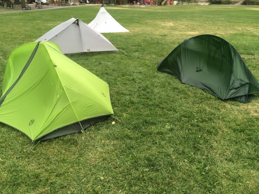terra nova solar photon 2 - tents set up in the park just before a thunderstorm and subject to...