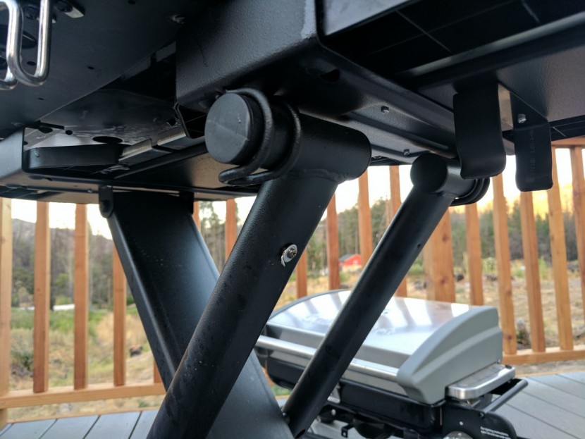 coleman roadtrip lxe - hooks underneath the right side of the grill that the top end of the...