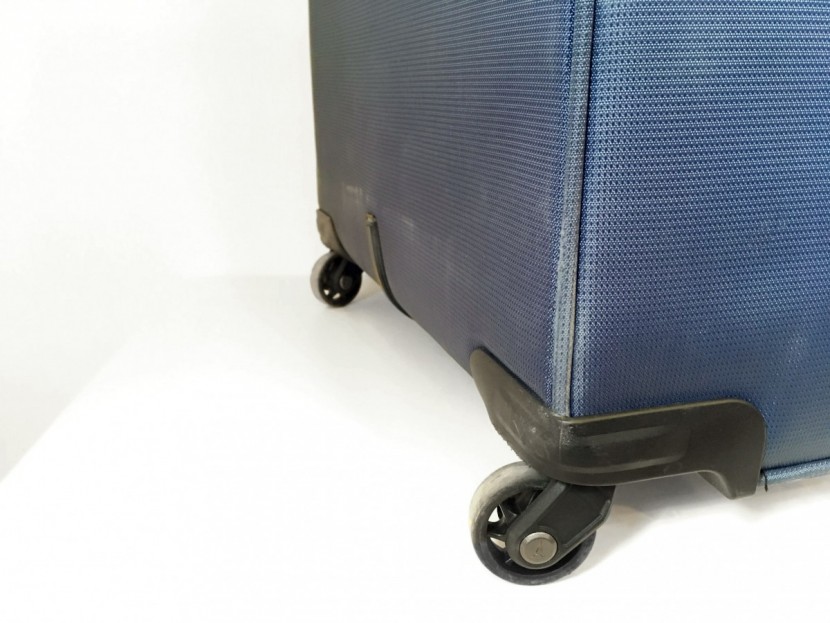 travelpro maxlite 4 25" - some battered edges and fuzzy fabric after navigating concrete stairs.