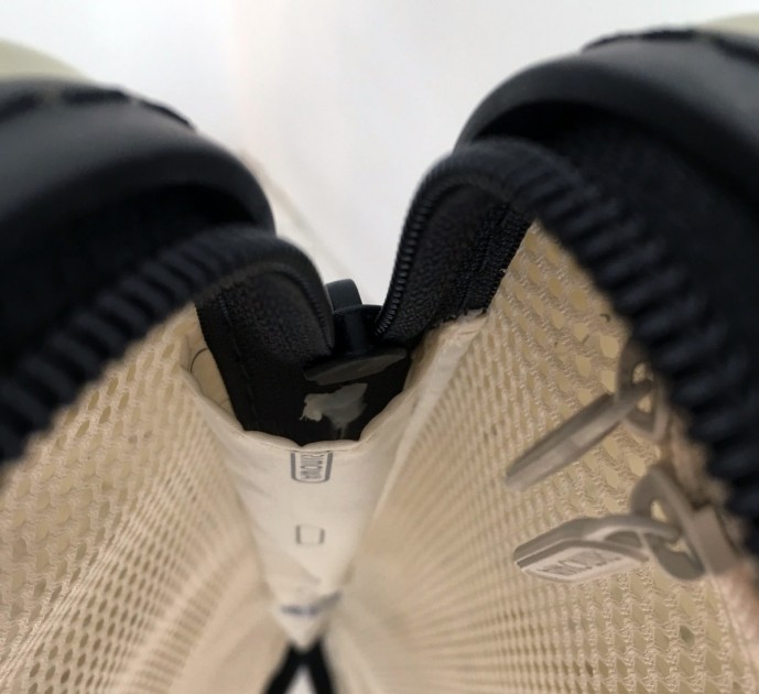 rimowa salsa air 29" - hot-glue used in lieu of a proper zipper stop.