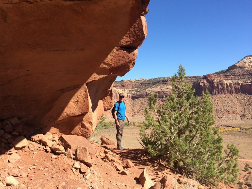 the north face paramount 3.0 - hiking along an exposed ledge on the way to some cliff ruins in the...