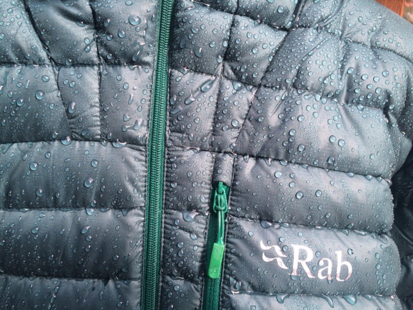 down jacket men - here you can see the how well the dwr coating works to prevent light...