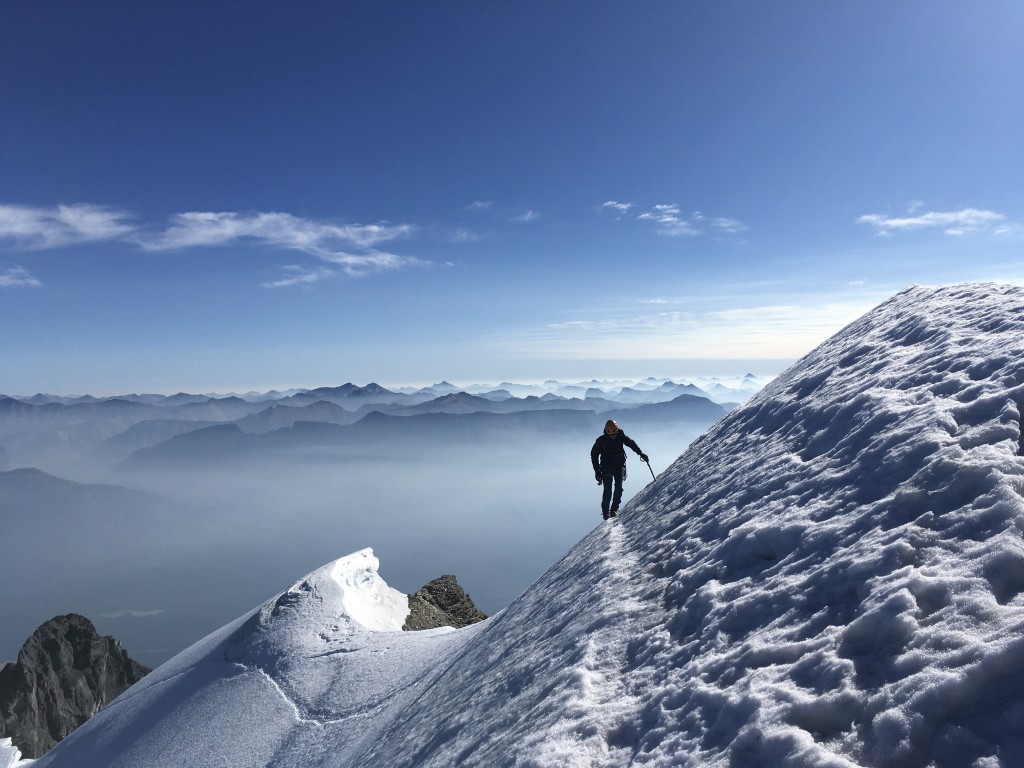 mountaineering boot womens - luke nearing the summit of mount temple. alberta, canada.