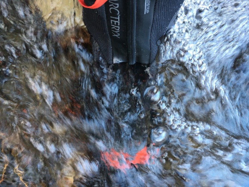 arc'teryx acrux ar - waterproofness testing. we stood in this creek for over a minute. no...