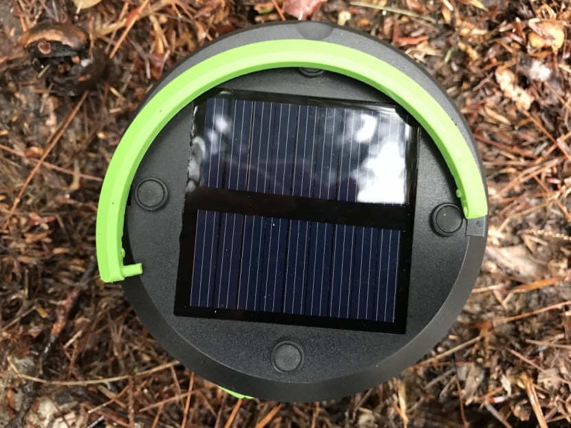 suaoki led - on the right side of the handle, the point where it attaches to the...