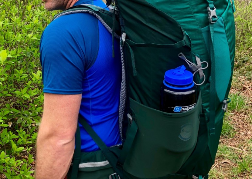 deuter aircontact lite 65+10 - this model featured a stretchy mesh water bottle pocket on either...