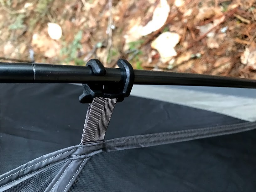 kelty trailogic tn2 - pole hugging clip requires a twist and a little dexterity to attach.