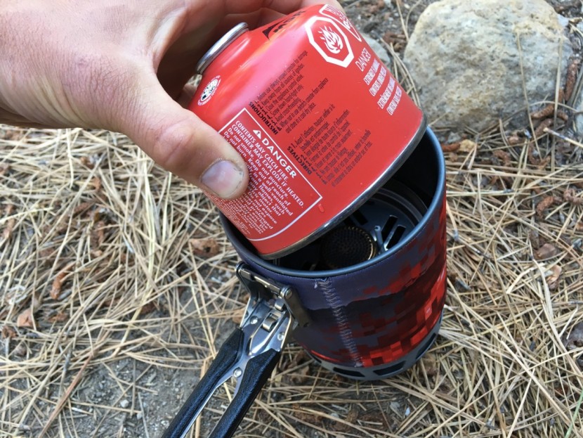 camp chef stryker multi-fuel - the pot on the stryker swallows it's burner and an 8 oz fuel canister.