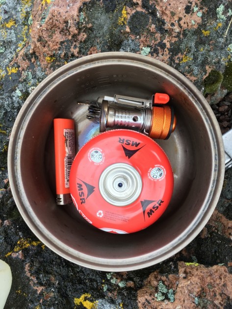 etekcity ultralight - packed in a 1l pot with a 4 oz fuel can and lighter, there is room...