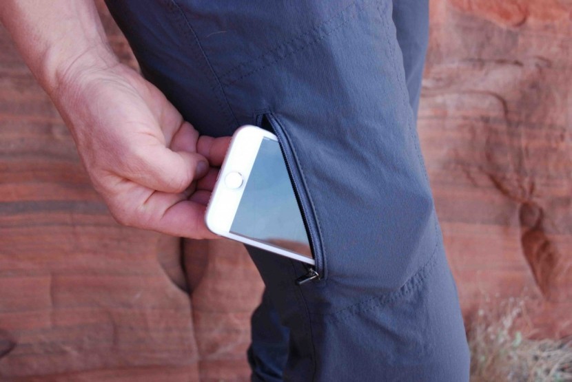 the zippered pocket on the leg can fit a smartphone in it.