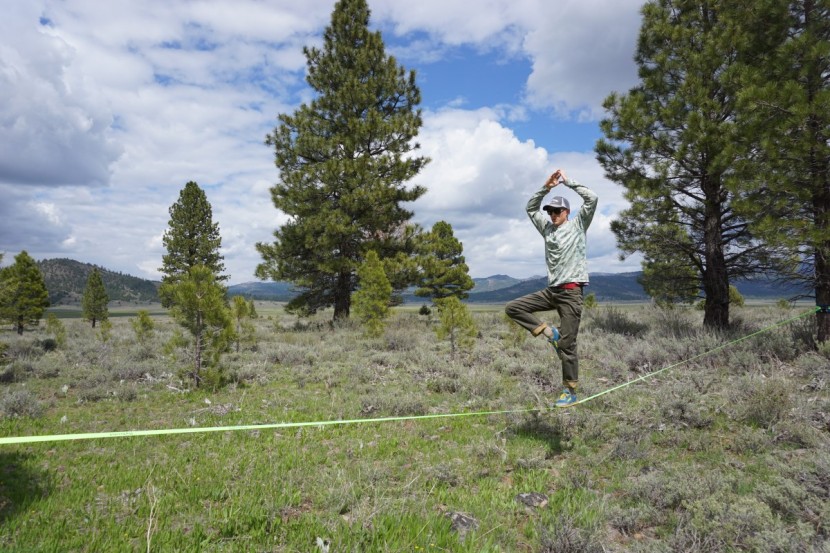flybold slackline kit - one of our testers gets tricky with a static yoga pose.