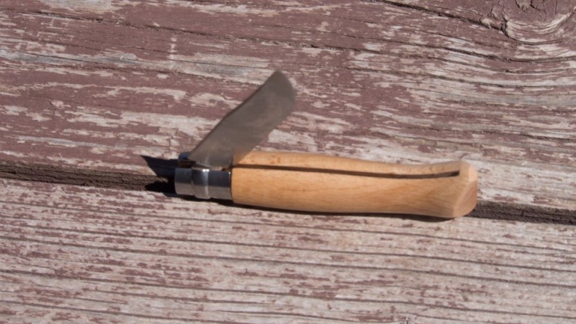pocket knife - here the "virobloc" ring of the opinel is turned to allow the blade...