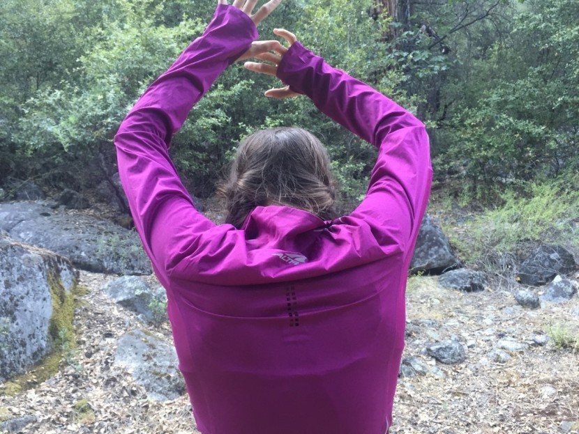 altra performance half-zip for women - modeling the tight, stiff fit of the performance's shoulders and back.