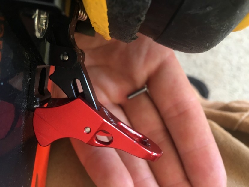plum race 150 - this photo shows the red toe lock lever displaced beyond and below...