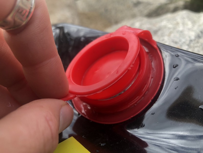 coghlan's 5-gallon - the closure on the coghlan's pops open easily with little provocation.