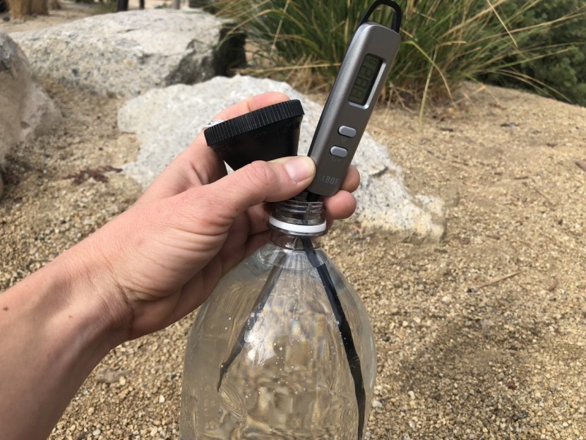 simple shower - heat up your water by letting it sit in the sun for a while.