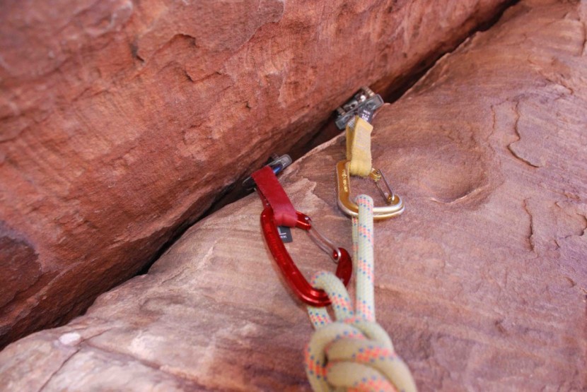 black diamond neutrino - a yellow neutrino racked on a gold camalot. the shape of these...