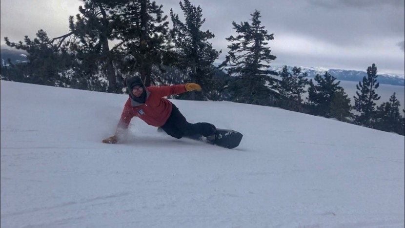 ride warpig - deep toeside turn overlooking lake tahoe.