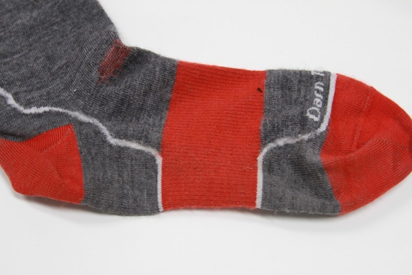 ski socks - compression paneling around the arch of the foot with a thin design...