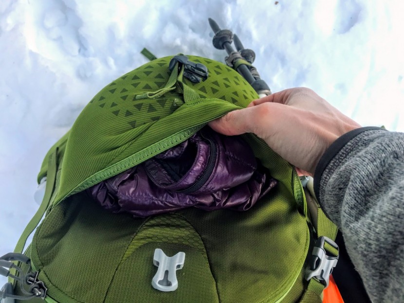 the mesh pocket is stretchy and can easily hold an insulating layer.