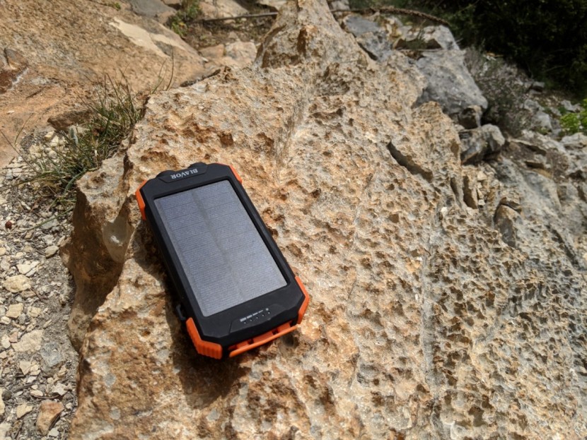 qi 10,000mah - the qi trying to soak up some solar rays on a sunny limestone bench.
