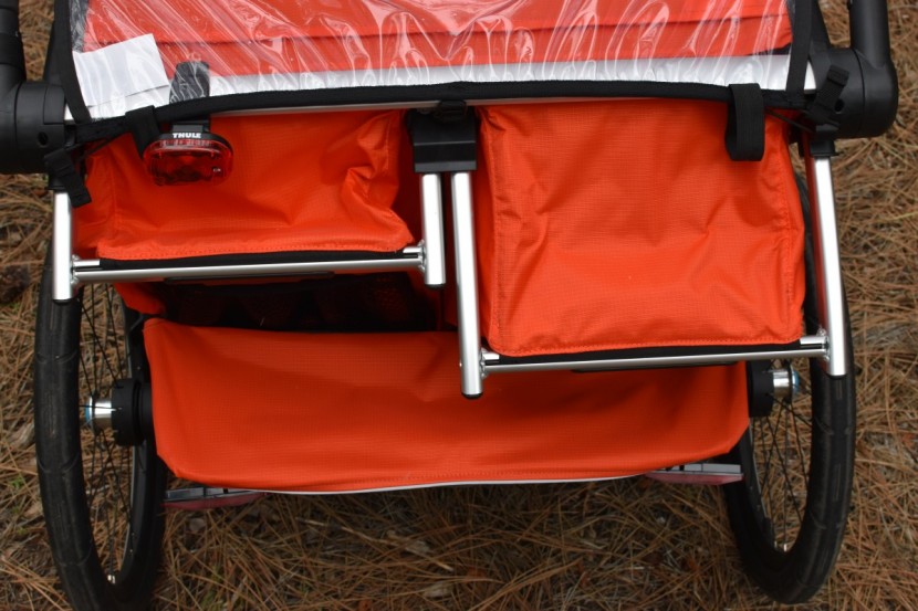 bike trailer - between reclinable seating and independent adjustments for each...