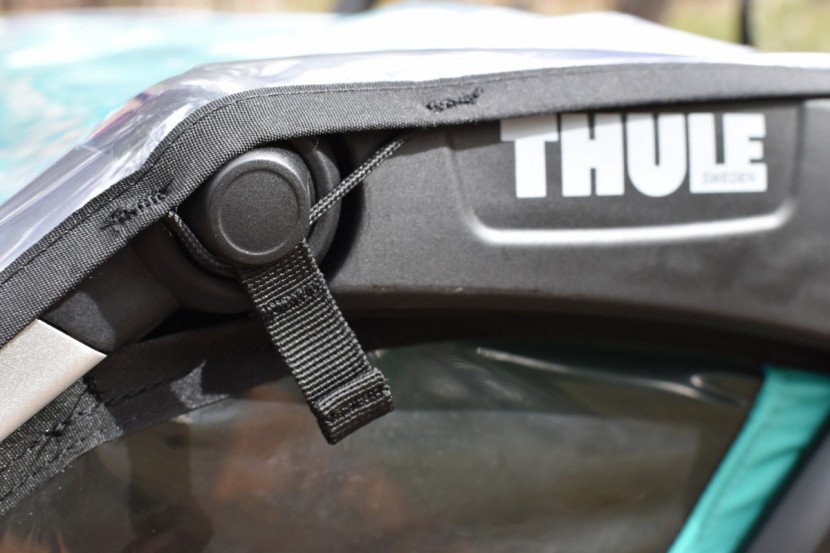 thule chariot lite 2 - the rain shield has three attachment points on each side, plus six...