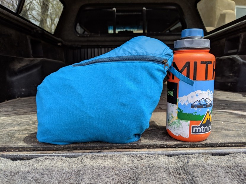 marmot ether driclime - although it appears to pack down to a size larger than a nalgene...
