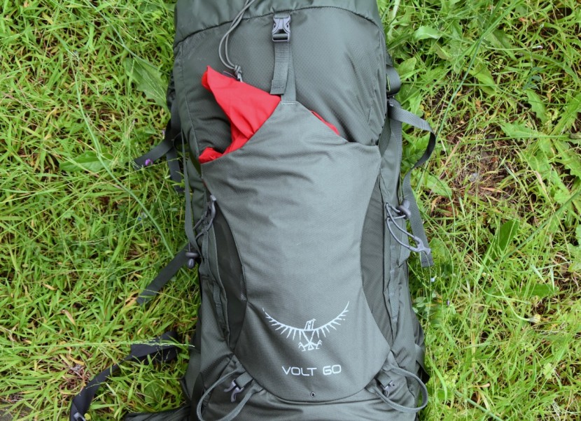 osprey volt 60 - we really liked the stretchy rear pocket. it closes via a buckle at...