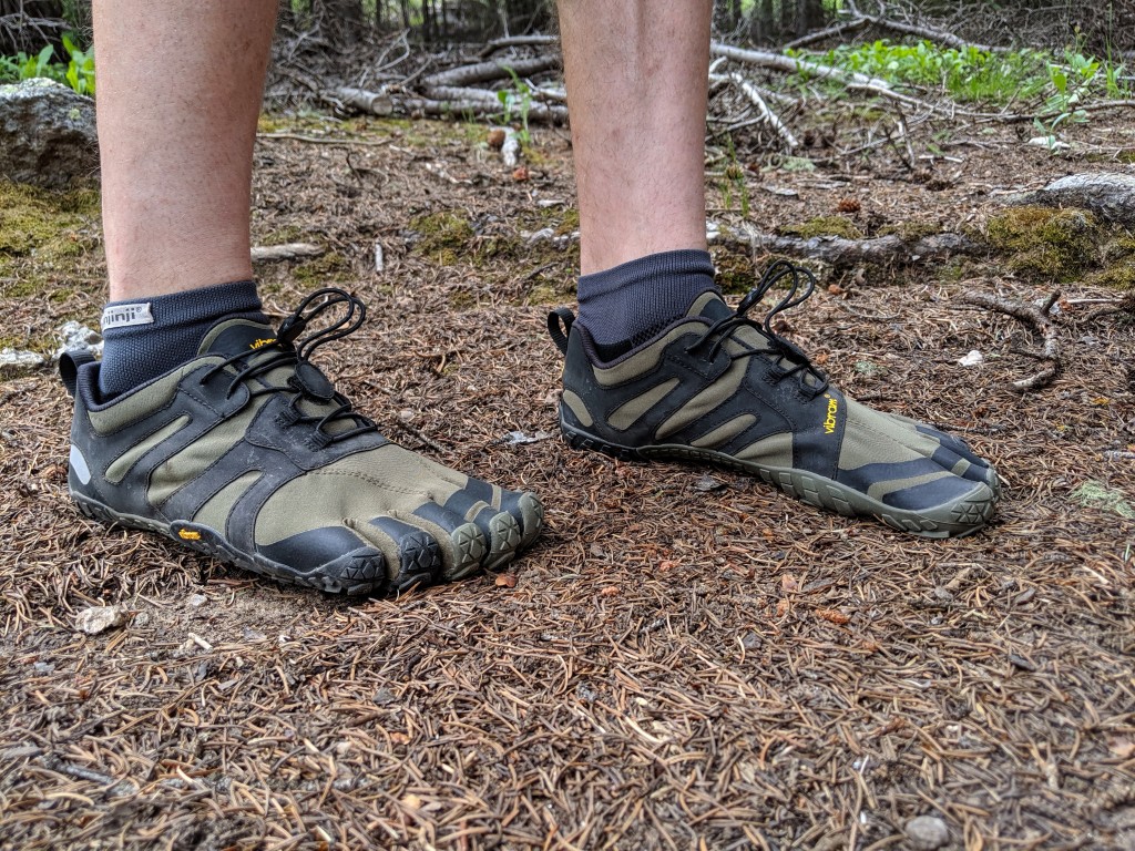 vibram v-trail 2.0 - the snug fit of this shoe is braced across the top by a quick-lacing...