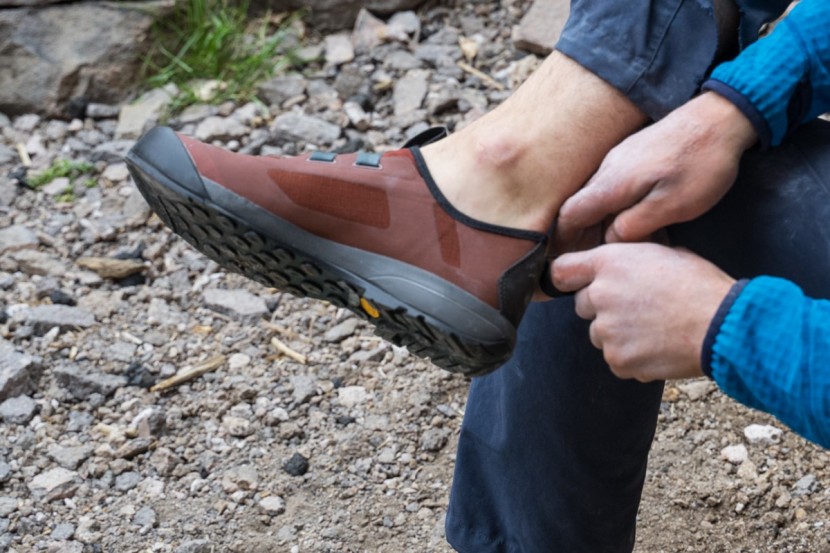 arc'teryx arakys - a pull-tab doubles as a clip-in point for securing the shoes to your...