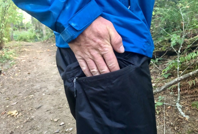 rei co-op essential rain pants - this model only features one side zippered pocket, which doubles as...